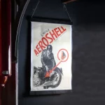 Affiche AEROSHELL, motard et bidon d'huile, Francis Bernard 1933.