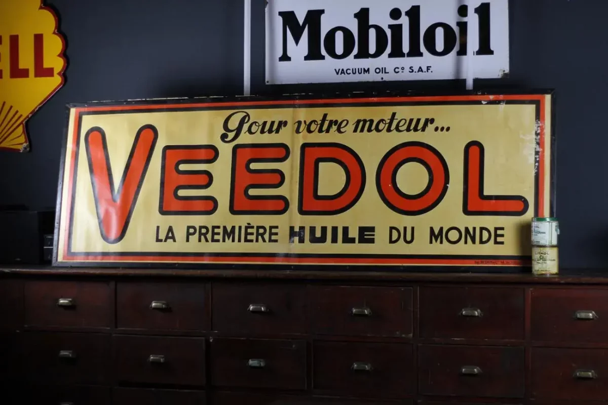 Affiche zinc Veedol, couleurs éclatantes.