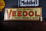 Affiche zinc Veedol, couleurs éclatantes.