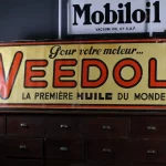 Affiche zinc Veedol, couleurs éclatantes.